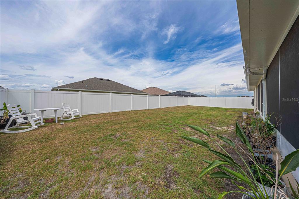 This is a floor plan for a 3,000-square-foot, four-bedroom, three-bathroom home with a garage — 5035 SW 91ST PLACE, OCALA, FL