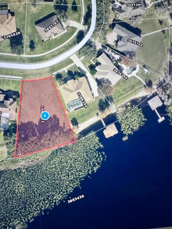 This is an aerial map showing a vacant waterfront lot highlighted in red — 10642 CRESCENT LAKE COURT, CLERMONT, FL