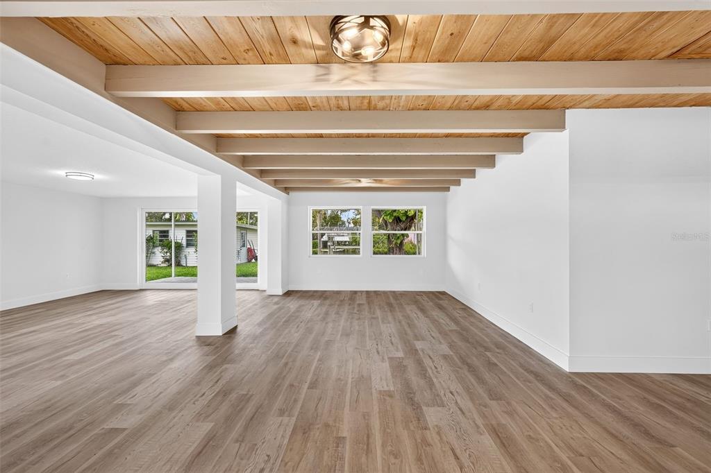 A single-story house with a carport, concrete driveway, and large trees on a grassy lawn — 341 SHORE DRIVE, ELLENTON, FL