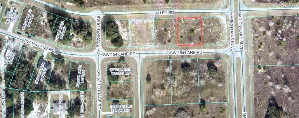 This is an aerial map showing a vacant rectangular lot outlined in red — 0 SW 154TH LN ROAD, OCALA, FL