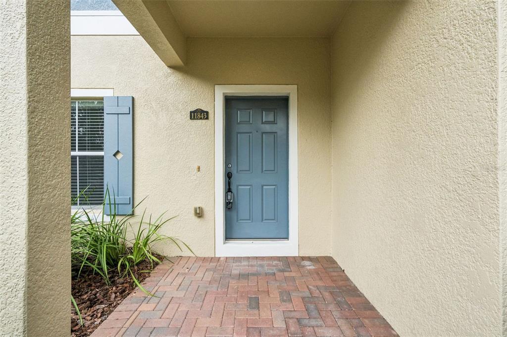 An aerial view shows a multi-unit residential building with a shingled roof and parking — 11843 DEER PATH WAY, ORLANDO, FL