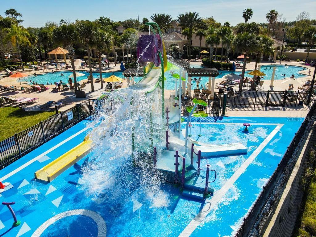 An outdoor water park features a splash pad, a dumping bucket, and a swimming pool — 2817 ALMATON LOOP UNIT 304, KISSIMMEE, FL