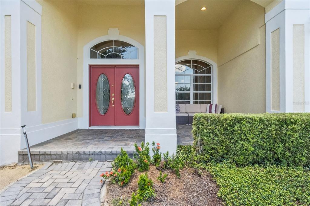 A living and dining area with tile floors, a ceiling fan, and a china cabinet — 1112 CALLAWAY CIRCLE, CLERMONT, FL