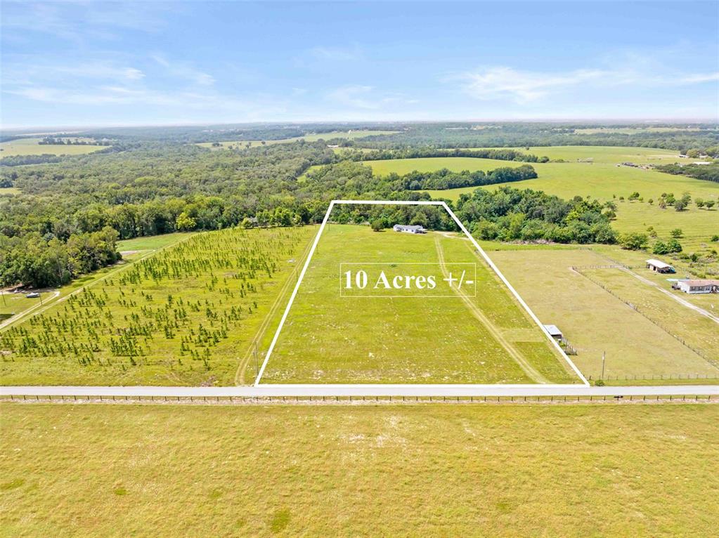 An aerial view shows a rectangular plot of land marked as approximately ten acres — 33320 LARKIN ROAD, DADE CITY, FL