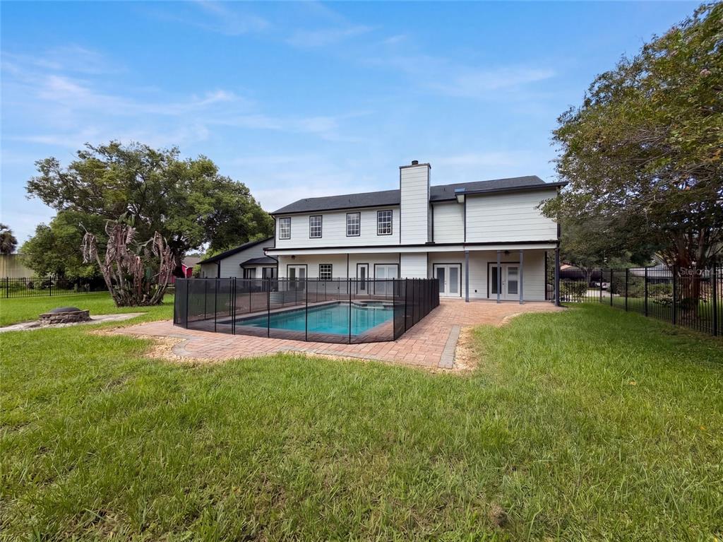 A two-story house with a fenced swimming pool and brick patio in the backyard — 120 LONGBRANCH ROAD, WINTER PARK, FL
