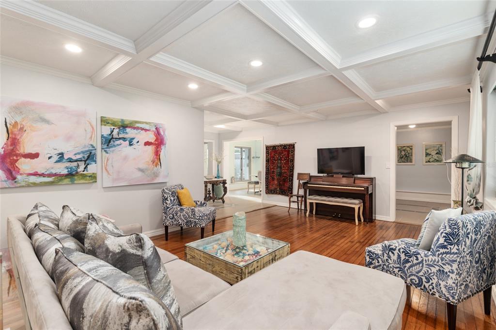 A kitchen features white cabinetry, a black refrigerator, a white stove, and dark granite countertops — 1210 SE 14TH AVENUE, OCALA, FL