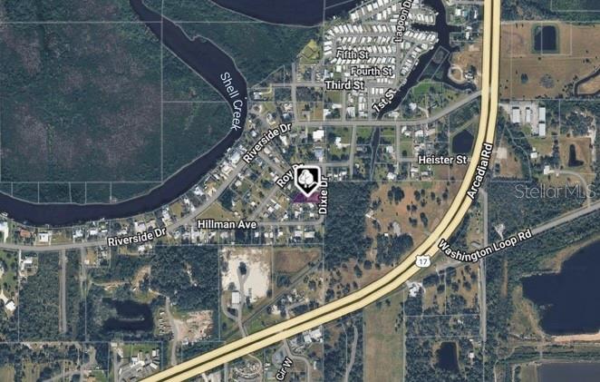 This is an aerial map showing a residential property highlighted in purple near Shell Creek — 2819 DIXIE DRIVE, PUNTA GORDA, FL