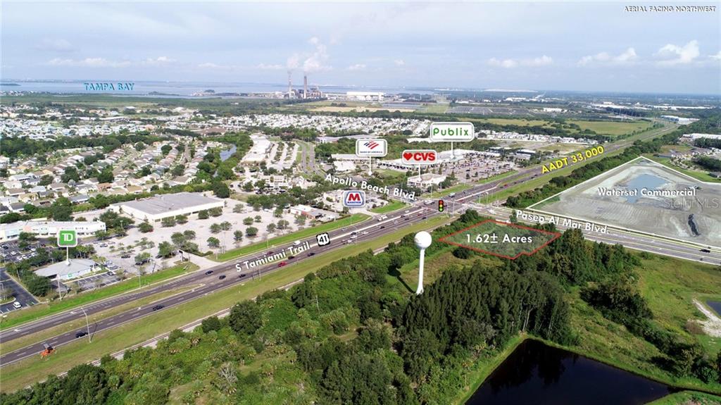 This aerial view shows a vacant 1.62-acre plot of land near a commercial intersection — S 41ST HIGHWAY, APOLLO BEACH, FL