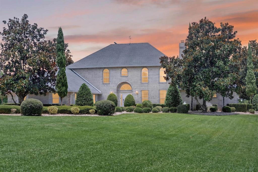 An aerial view of a house with a screened-in patio, pool, and large grassy yard — 350 FOX HOLLOW FARMS ROAD, PIERSON, FL