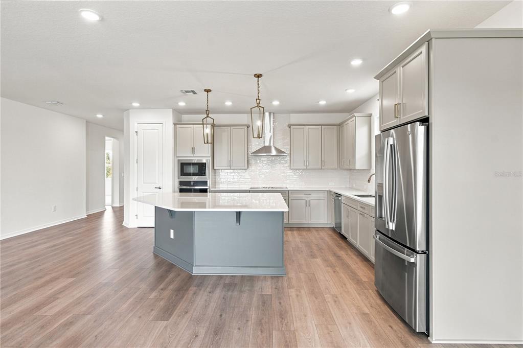 This floor plan shows a single-story home with three bedrooms, a study, and a garage — 5033 ORINOCO LANE, ST CLOUD, FL