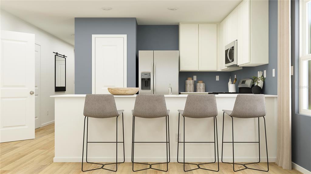 This is a digital rendering of a modern kitchen with a breakfast bar and four stools — 2930 CHERRY LANE, HAINES CITY, FL