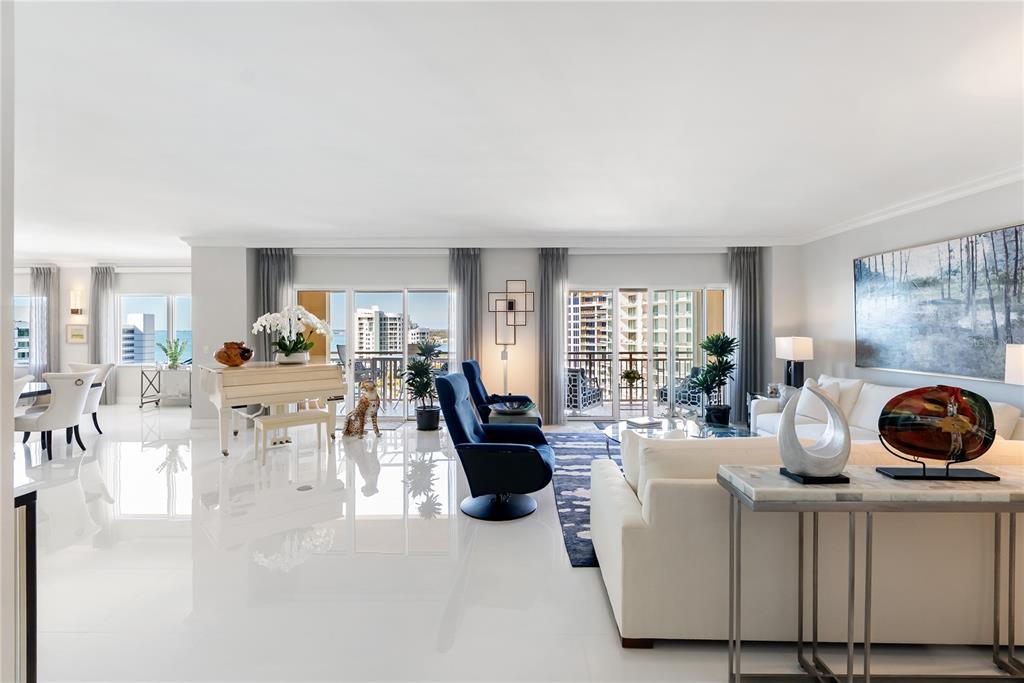 An aerial view shows a large waterfront condominium complex with a pool and tennis courts — 1111 RITZ CARLTON DRIVE UNIT 1603, SARASOTA, FL