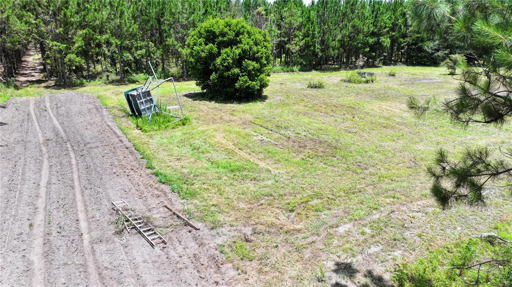 An aerial view shows a grassy lot with a fallen basketball hoop and a ladder — TBD SE 154TH AVENUE, WHITE SPRINGS, FL