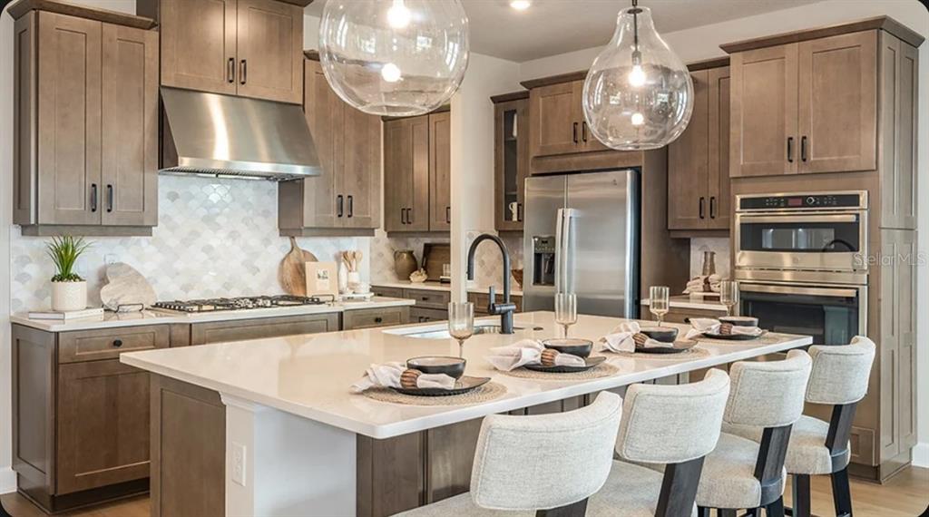 This is a floor plan for a single-story house with four bedrooms and a garage — 11783 RALLY RANGE WAY, SAN ANTONIO, FL