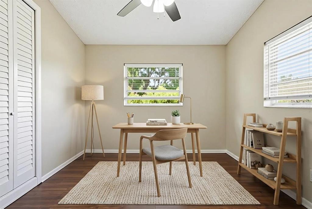 A home office featuring a wooden desk, chair, bookshelf, and a window with blinds — 5312 COVENTRY DRIVE, ORLANDO, FL