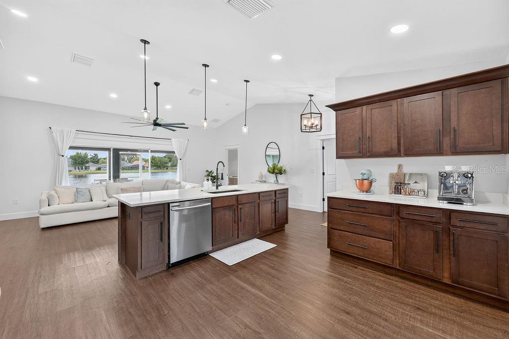A gray single-story house with a white garage door and a concrete driveway — 118 RACHEL LIN LANE, ST CLOUD, FL