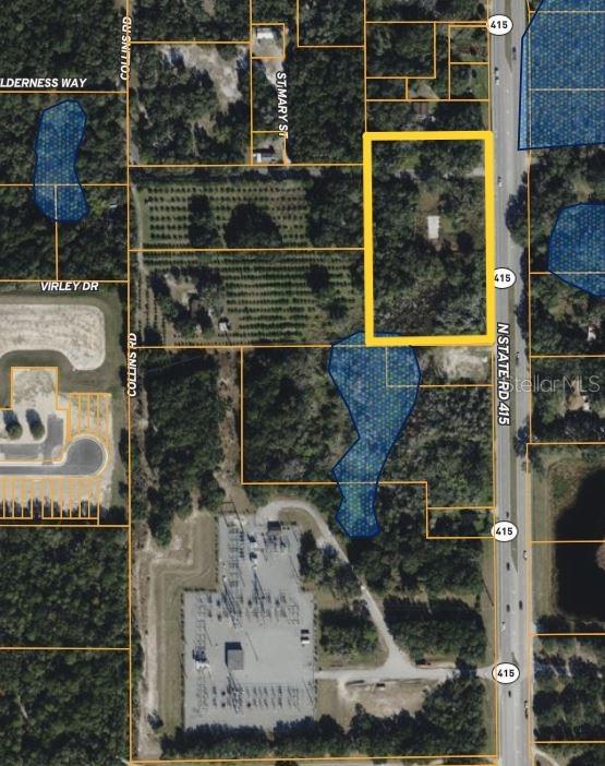 This is an aerial map showing a rectangular parcel of land outlined in yellow — 101 COLLINS ROAD, OSTEEN, FL
