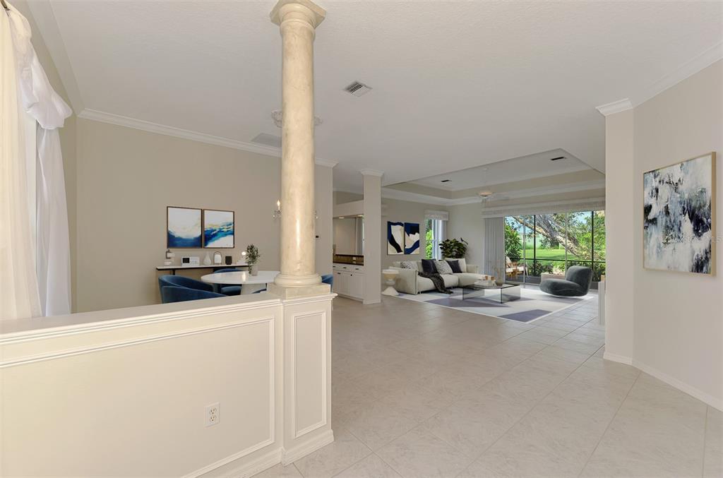 An entryway features double doors with oval glass inserts, a console table, and a mirror — 625 MISTY PINE DRIVE, VENICE, FL