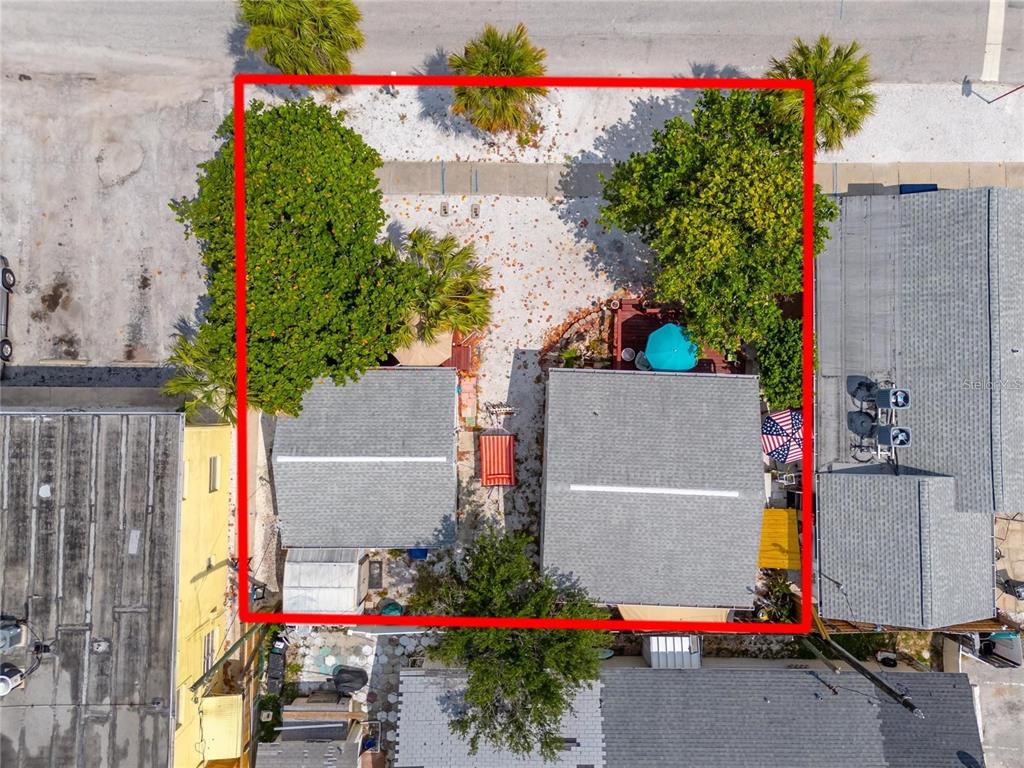 An aerial view shows two small houses on a lot outlined in red — 608 72ND AVENUE, ST PETE BEACH, FL