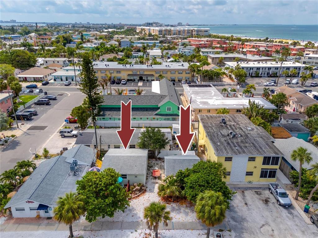 An aerial view shows two small, adjacent single-story buildings with gray roofs — 608 72ND AVENUE, ST PETE BEACH, FL