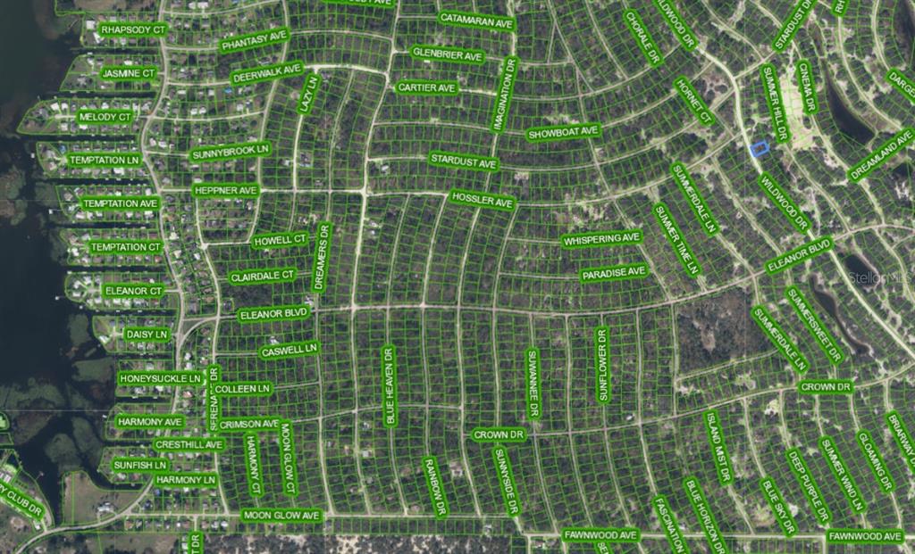 This is an aerial map showing a residential neighborhood with many streets and individual lots — 323 WILDWOOD DRIVE, LAKE PLACID, FL
