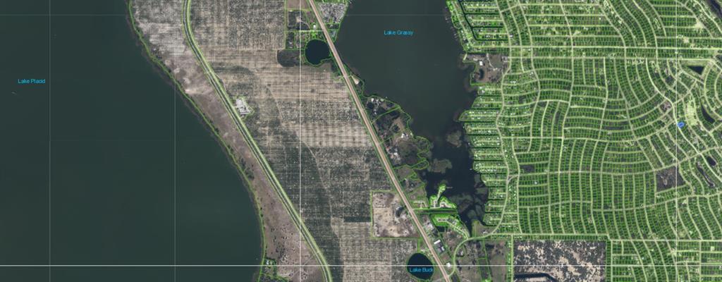 This aerial map shows Lake Grassy, Lake Placid, and surrounding residential lots in Florida — 323 WILDWOOD DRIVE, LAKE PLACID, FL