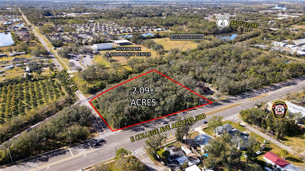 This aerial map shows a 2.09-acre wooded lot located at a street intersection — E COLLEGE AVE, RUSKIN, FL
