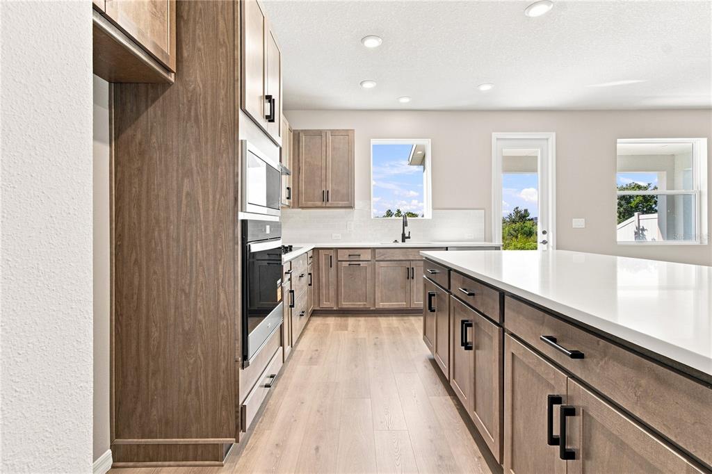This is a floor plan of a residential second story featuring four bedrooms, a retreat, and a laundry room — 3417 YELLOW CASSIA DRIVE, WESLEY CHAPEL, FL