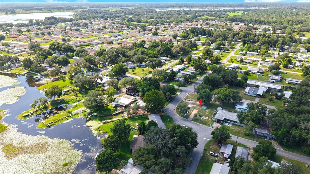 An aerial view shows a residential neighborhood with a red pin marking a specific property — 4672 N APACHE TRAIL, HERNANDO, FL