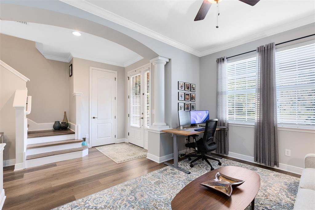 A home office area features a wooden desk, a computer, and stairs near the entryway — 463 ELLIS SQUARE COURT, SANFORD, FL