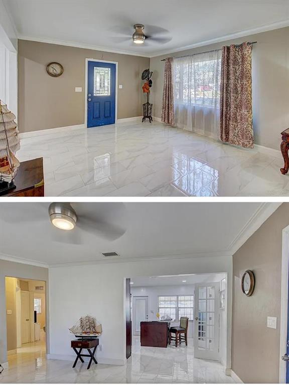This interior view shows a living area with white tile floors and a blue door — 1008 CHESTER DRIVE, CLEARWATER, FL