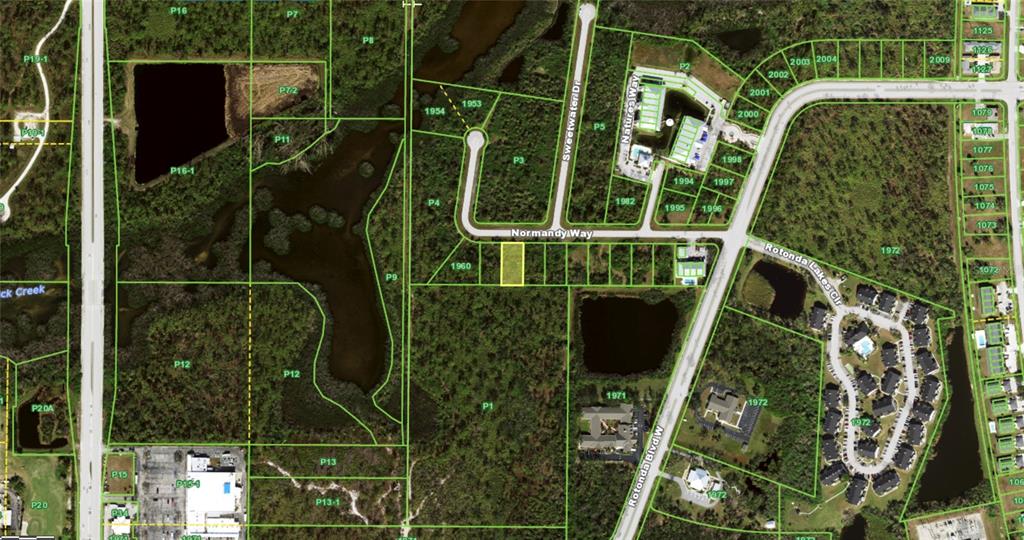 This is an aerial map showing a vacant lot highlighted in yellow along a residential street — 117 NORMANDY WAY, ROTONDA WEST, FL