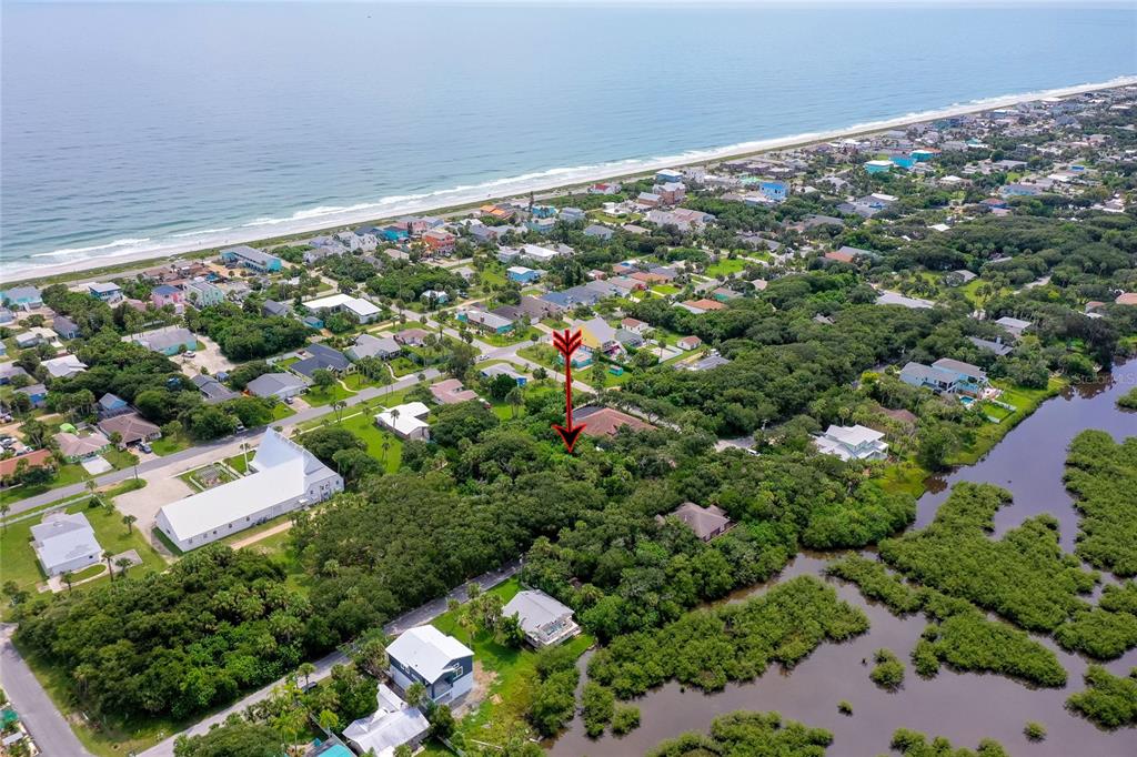 This aerial view shows a rectangular, wooded vacant lot outlined in red — 0 S FLAGLER, FLAGLER BEACH, FL