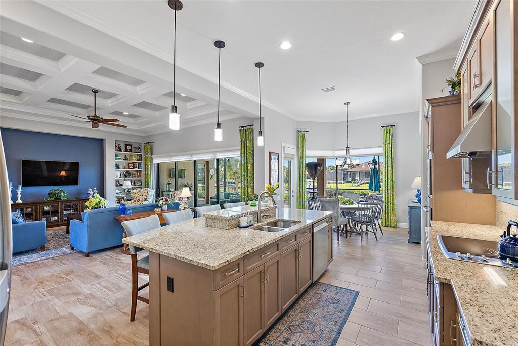 An aerial view shows four waterfront houses with tiled roofs, swimming pools, and private boat docks — 11739 RIVER SHORES TRAIL, PARRISH, FL