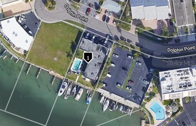 This is an aerial map view of a waterfront building with a pool and boat slips — 223 DOLPHIN POINT, CLEARWATER BEACH, FL