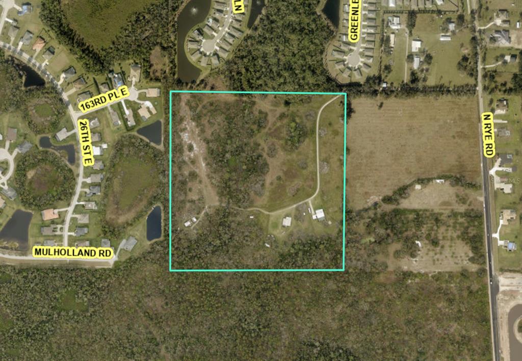 This aerial map shows a rectangular plot of land with structures and trees — 2405 N RYE ROAD, PARRISH, FL