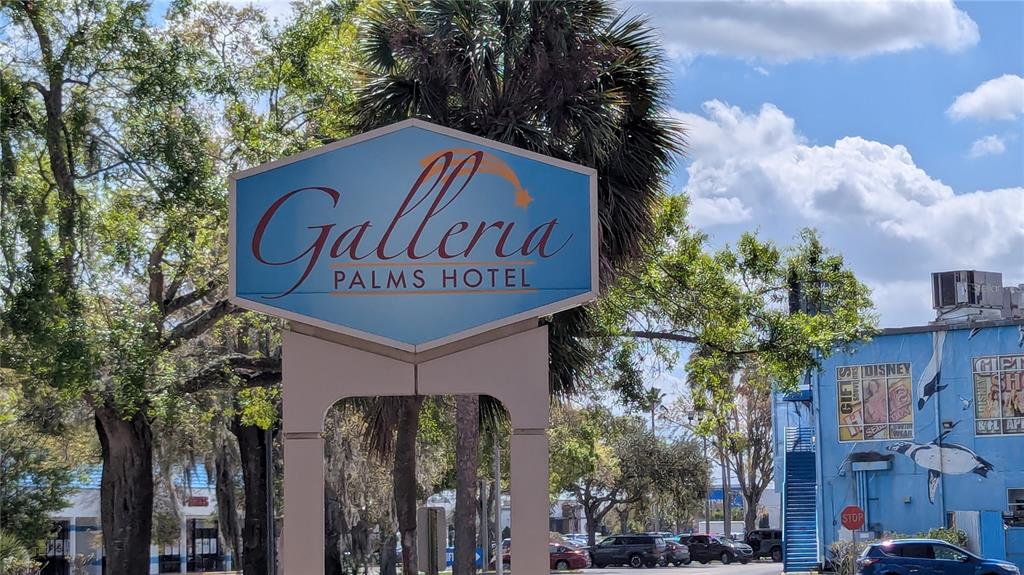 A sign for the Galleria Palms Hotel stands in front of trees and buildings — 3000 MAINGATE LANE UNIT 421, KISSIMMEE, FL