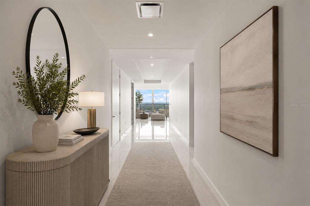 A high-rise balcony with a glass railing overlooks a city skyline and the ocean — 400 CENTRAL AVENUE UNIT 2901, ST PETERSBURG, FL