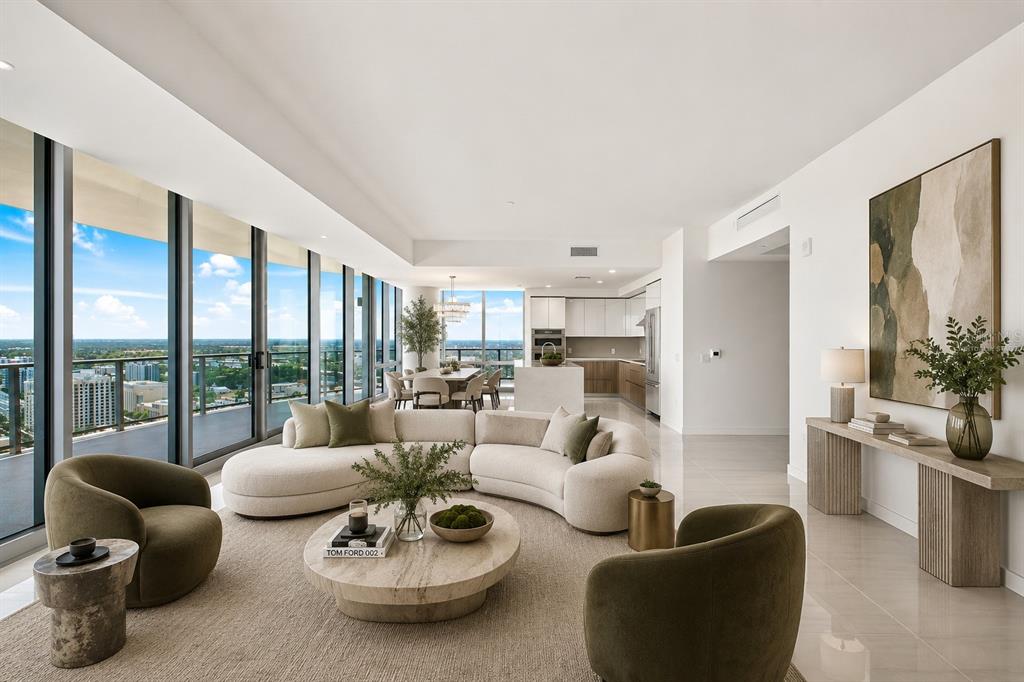 A bright, empty room with white tile floors features floor-to-ceiling windows overlooking a city skyline — 400 CENTRAL AVENUE UNIT 2901, ST PETERSBURG, FL
