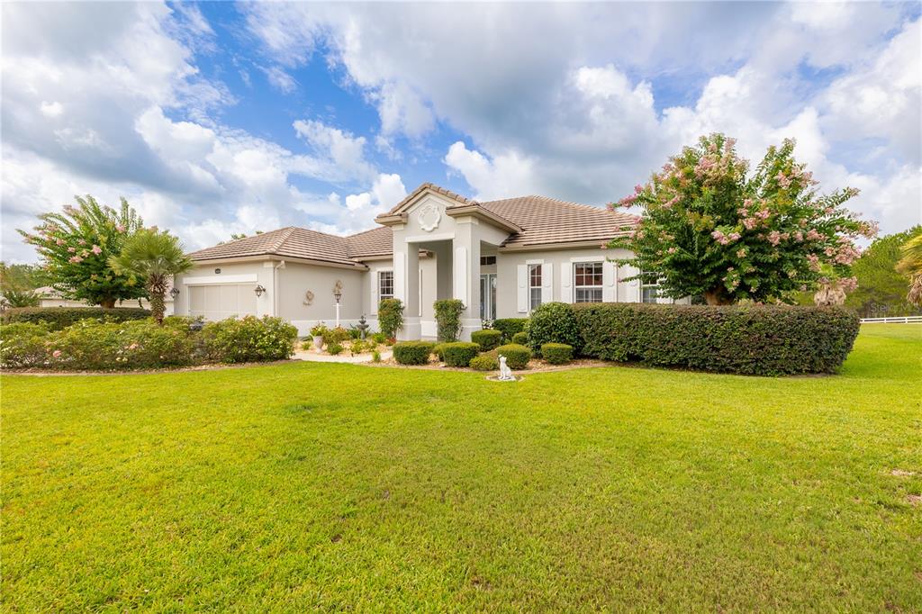 A kitchen with light wood cabinets, a center island, and stainless steel appliances — 1626 E GATE DANCER CIRCLE, INVERNESS, FL