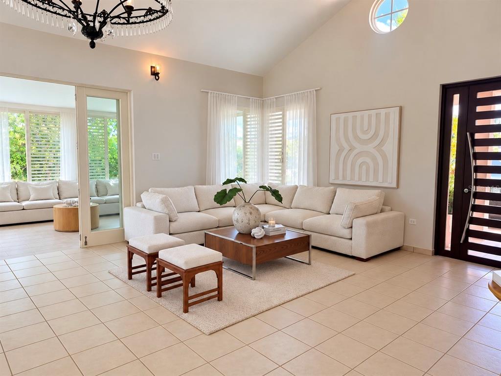 An aerial view shows a paved driveway leading to a house with a tiled roof — 302 CAMINO DE LOS CEDROS, DORADO, PR