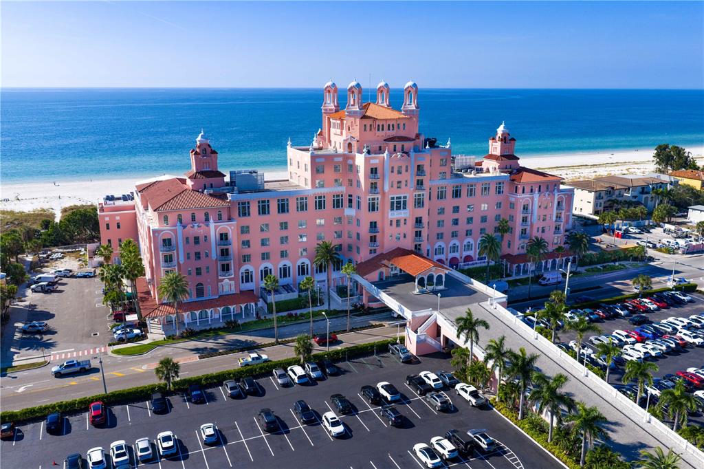 An aerial view shows the pink Don CeSar hotel situated on a sandy beach — 3614 GULF BOULEVARD, ST PETE BEACH, FL