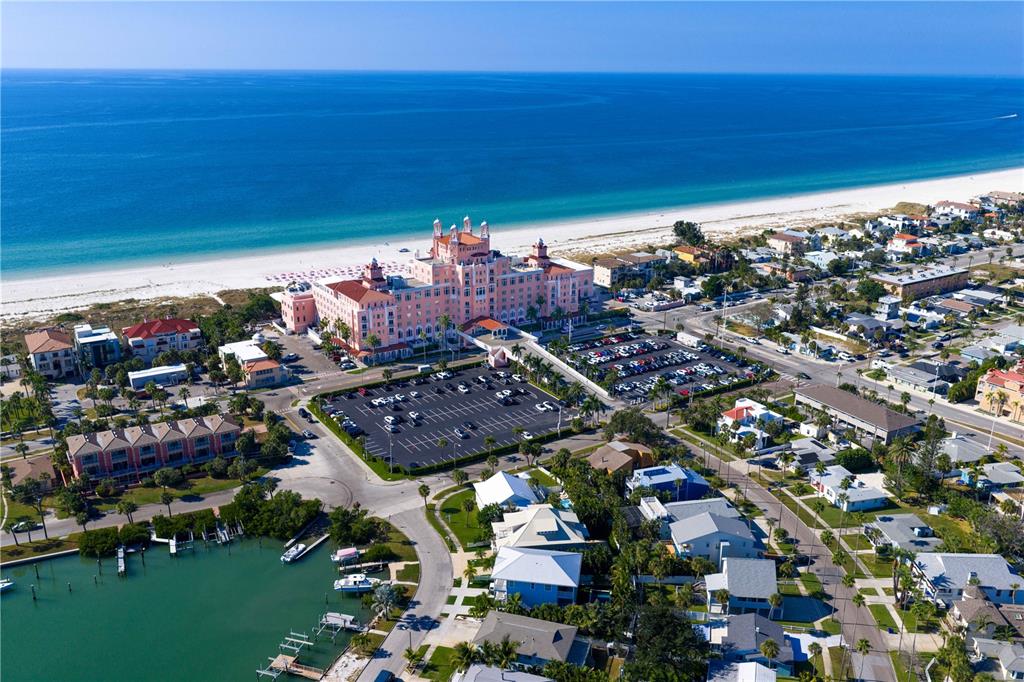 An aerial view shows a vacant lot outlined in red near a sandy beach — 3614 GULF BOULEVARD, ST PETE BEACH, FL