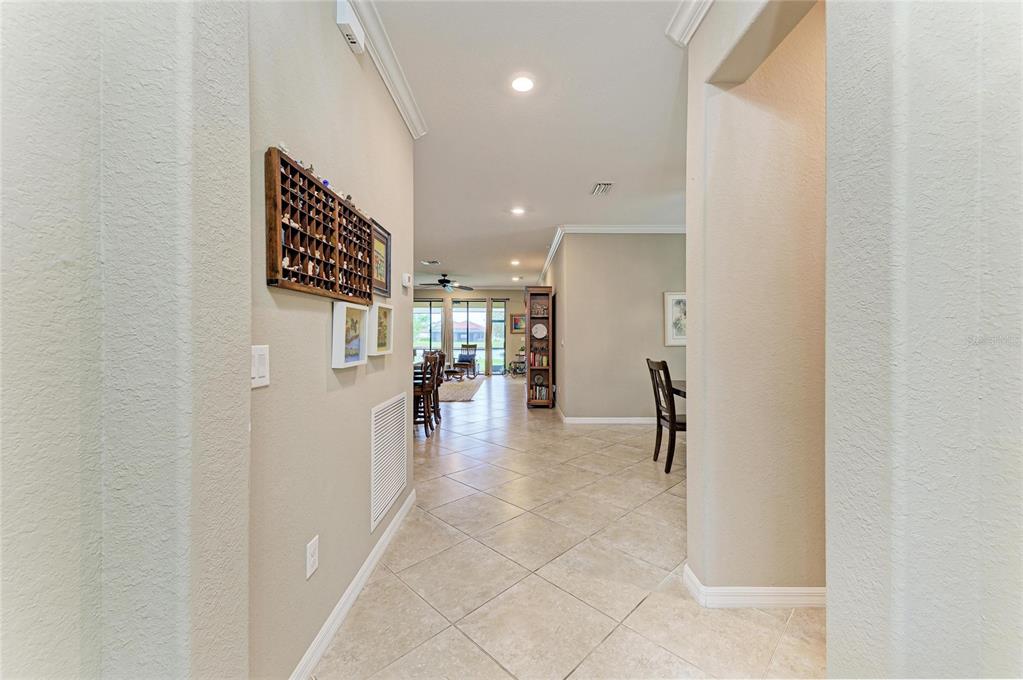 A tiled entryway leads into an open-concept living area with a view of the outdoors — 3512 SAVANNA PALMS COURT, LAKEWOOD RANCH, FL