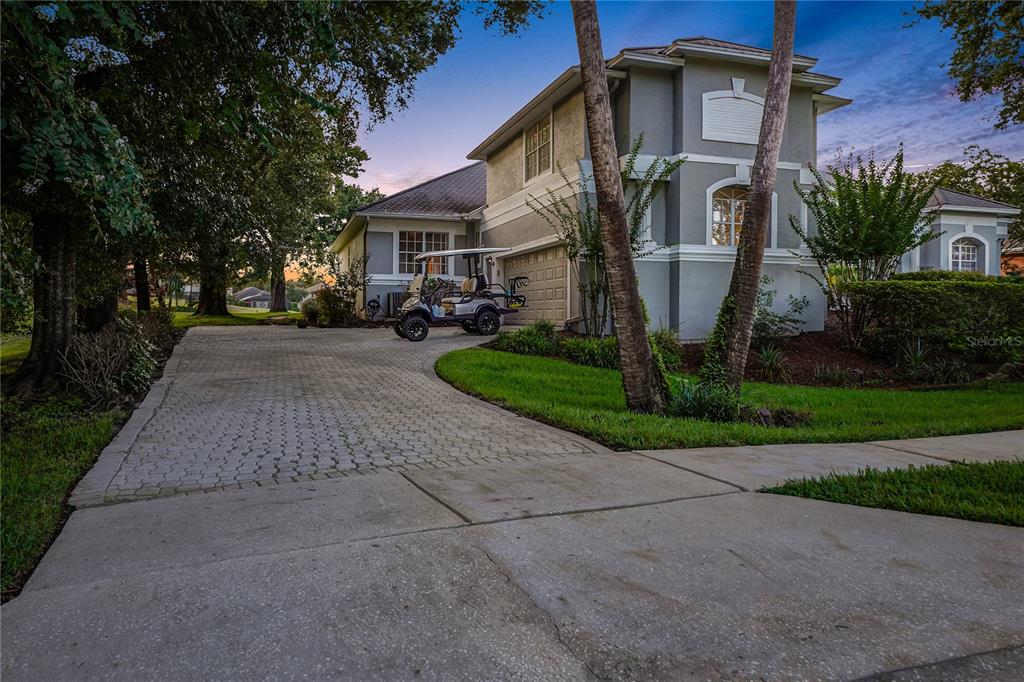 A living room with a gray sectional sofa, a wooden coffee table, and a bookshelf — 600 CHOCKTAW STREET, LAKE MARY, FL