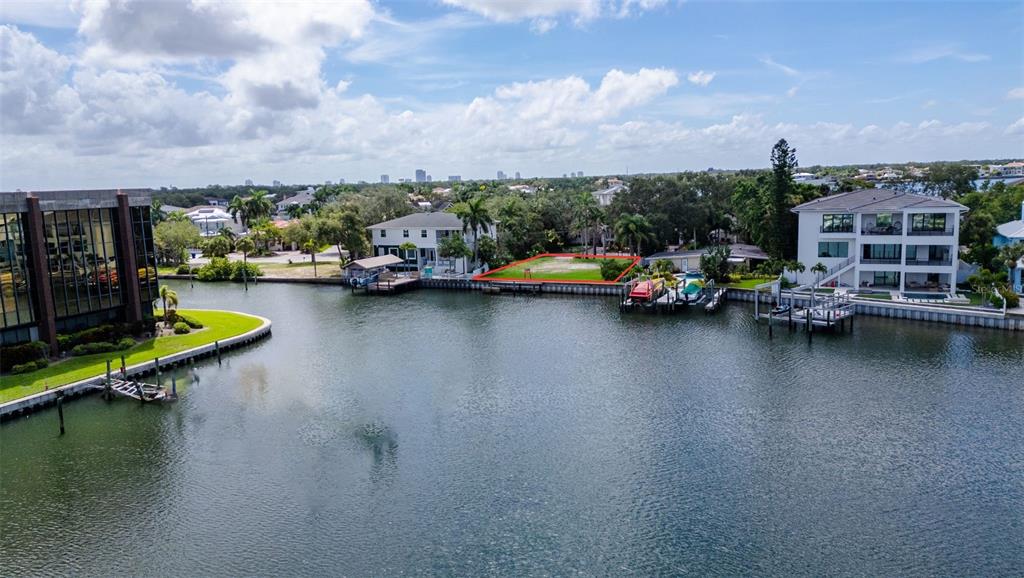 An aerial view shows a house marked with a pin near a marina and waterway — 52 SANDPIPER ROAD, TAMPA, FL