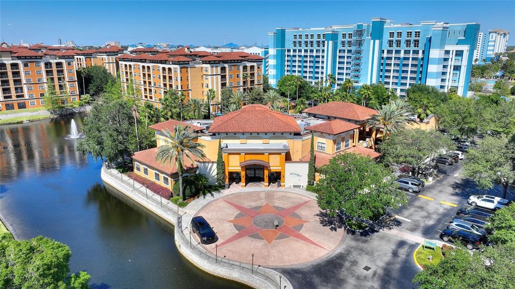 An aerial view shows a resort building with a circular driveway, lake, and parking lot — 12544 FLORIDAYS RESORT DRIVE UNIT 508B, ORLANDO, FL