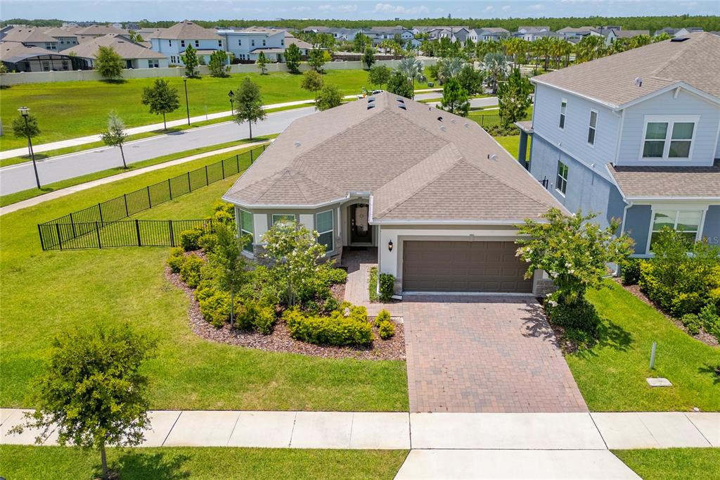 An aerial view of a single-story house with a paved driveway and a two-car garage — 13270 PANAMA BEACH COURT, ORLANDO, FL