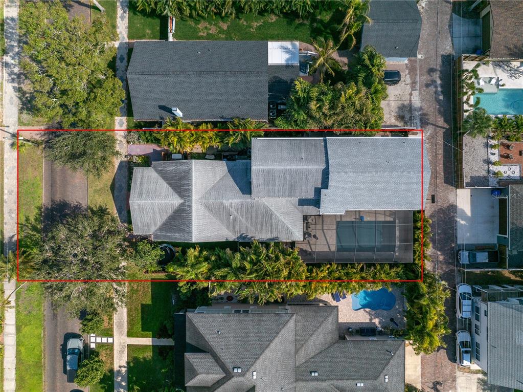 An aerial view shows a house with a screened-in pool and a red boundary line — 436 12TH AVENUE NE, ST PETERSBURG, FL