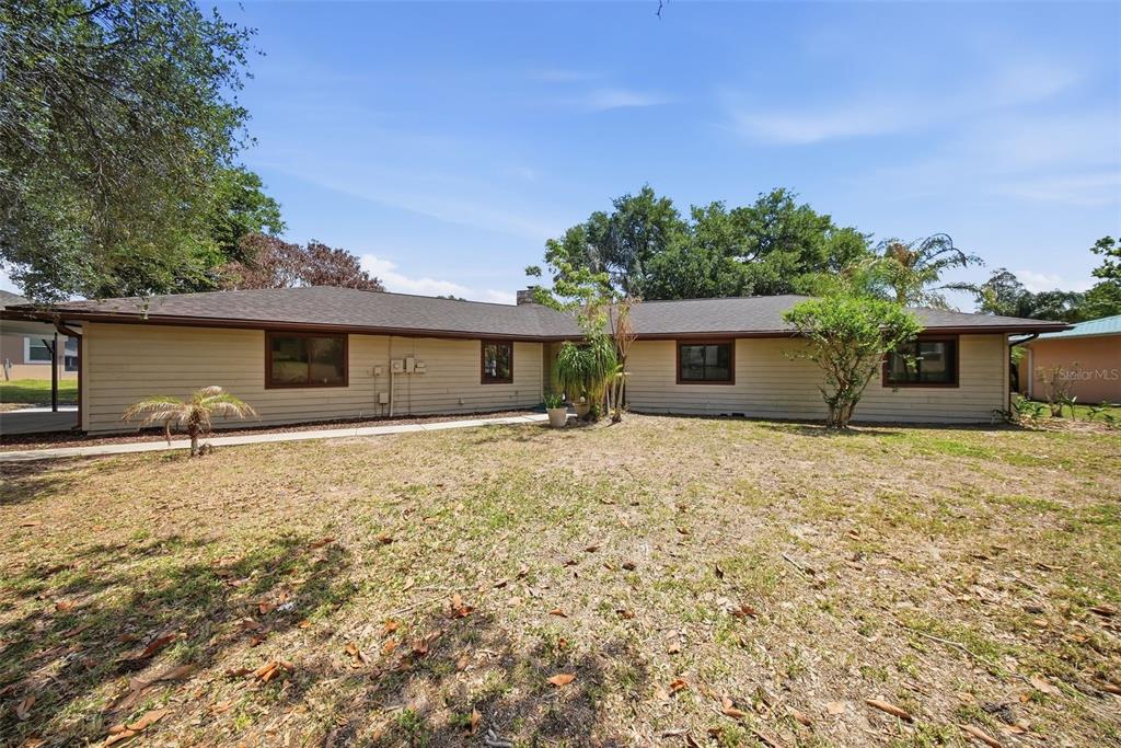 An aerial view shows a house with a red location pin near a large lake — 410 S RAMONA AVENUE, LAKE ALFRED, FL